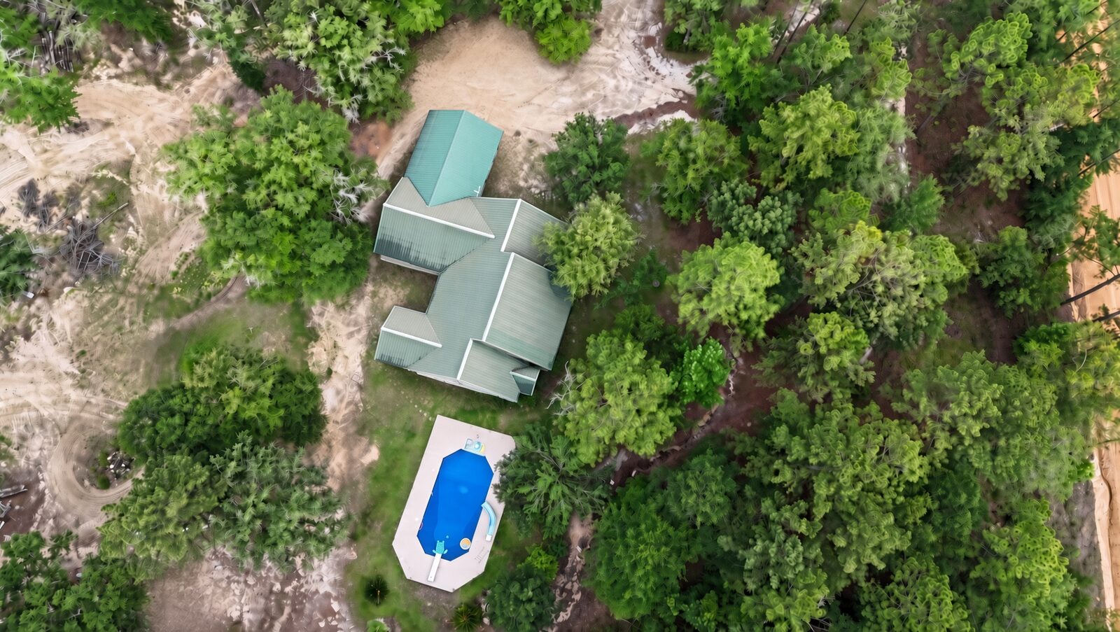Aerial view of home with pool by Surreal Drone Services
